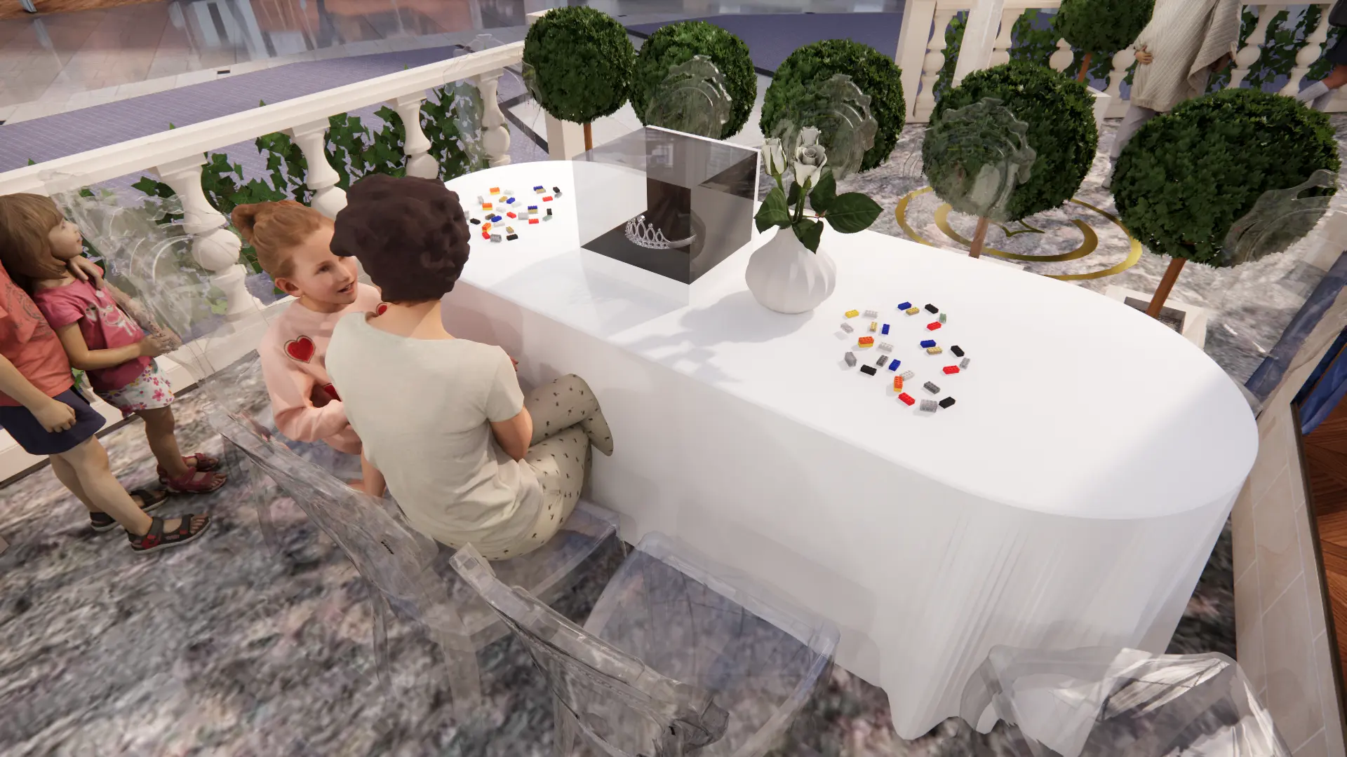 Table d’atelier avec couronne sous vitrine, briques de jeu et enfants assis