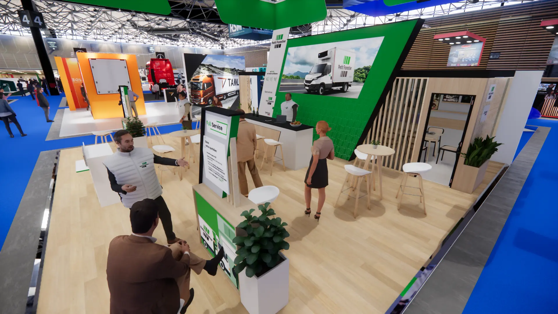 Vue en hauteur du stand ouvert, tables hautes et cabine de réunion vitrée