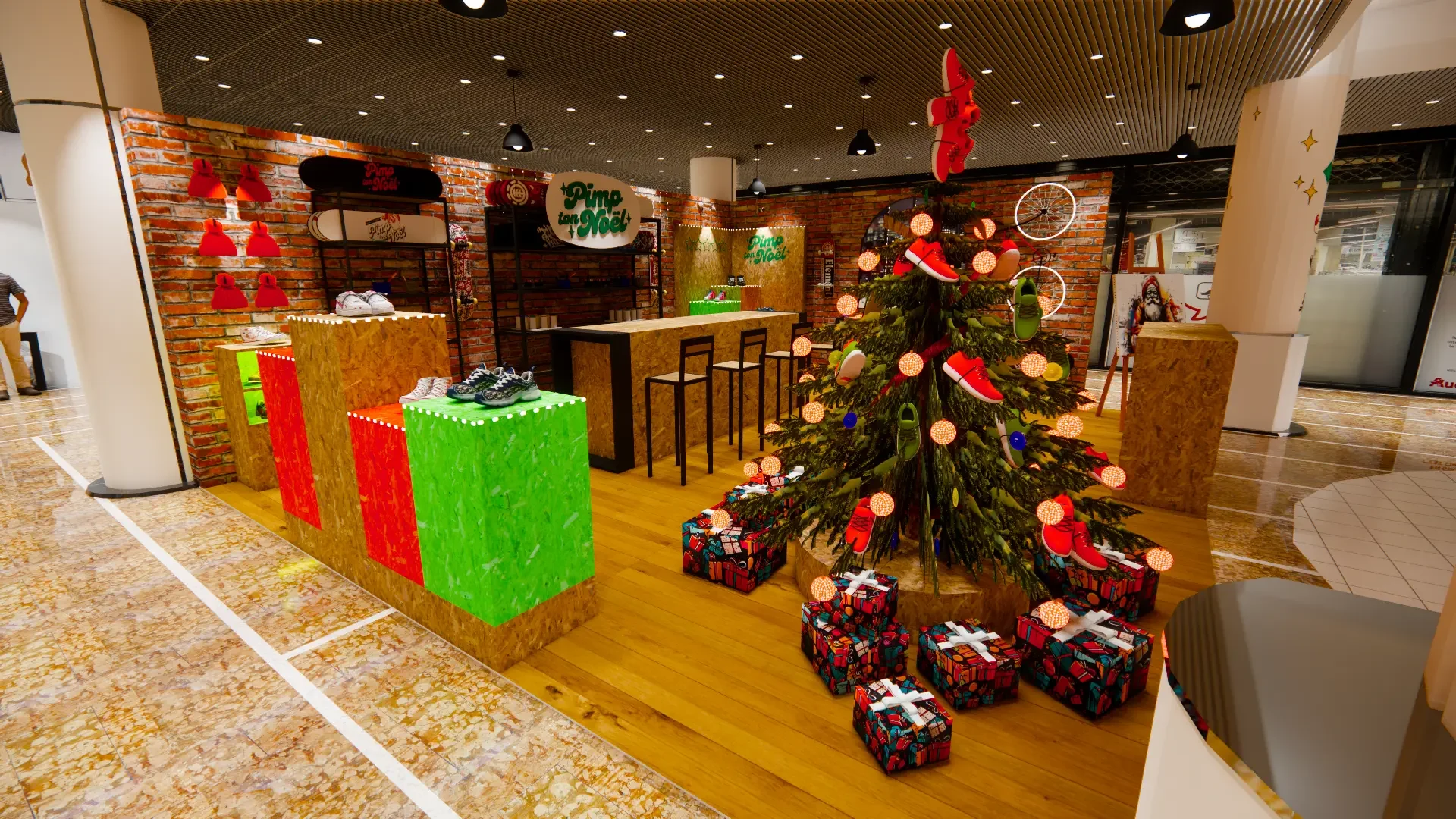 Le sapin et ses cadeaux devant les comptoirs en bois